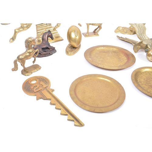 263 - A collection of assorted 20th century decorative brass items. The collection to include brass paperw... 