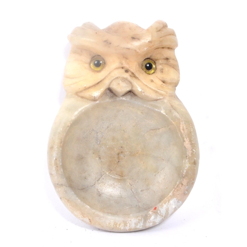 273 - Early 20th century carved stone soap dish / ash tray. In the form of an owl with glass eye decoratio... 