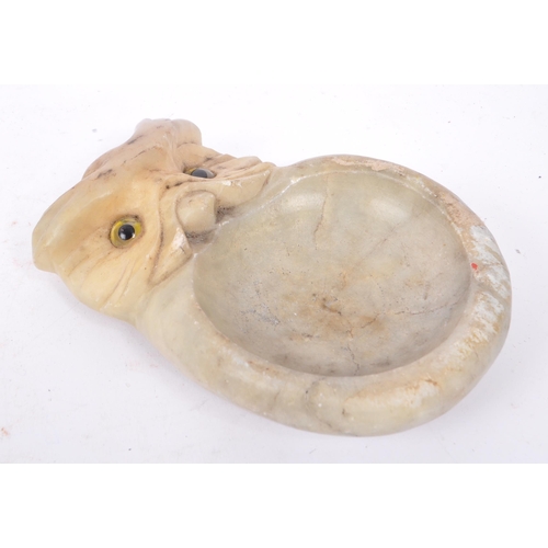 273 - Early 20th century carved stone soap dish / ash tray. In the form of an owl with glass eye decoratio... 