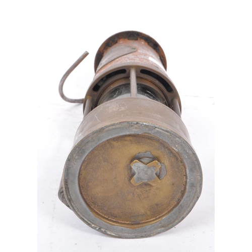 274 - A 20th century brass and metal miners lamp. Manufactured by The Protector Lamp & lighting Co Ltd. Sa... 