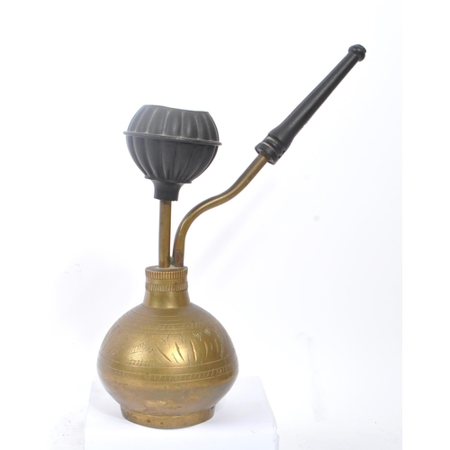 276 - A 19th century Asian shisha smoking pipe. With inscribed decoration to body, and circular top for sm... 