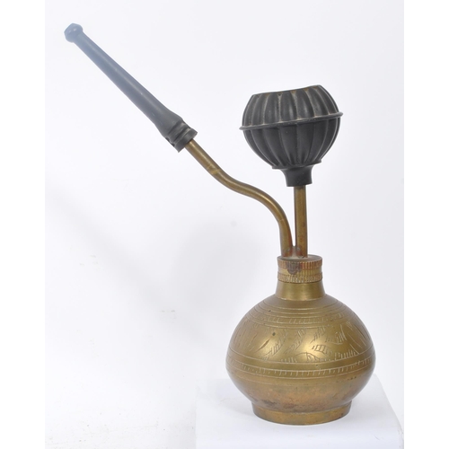 276 - A 19th century Asian shisha smoking pipe. With inscribed decoration to body, and circular top for sm... 