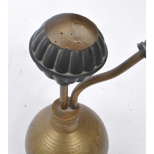 276 - A 19th century Asian shisha smoking pipe. With inscribed decoration to body, and circular top for sm... 