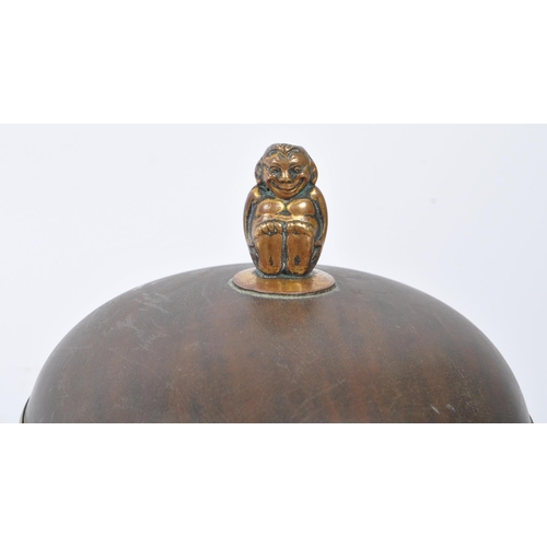 277 - An early 20th tortoise shell dome form jewellery trinket box. Having a monkey finial to top. Measure... 