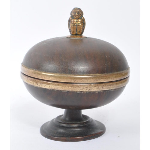 277 - An early 20th tortoise shell dome form jewellery trinket box. Having a monkey finial to top. Measure... 