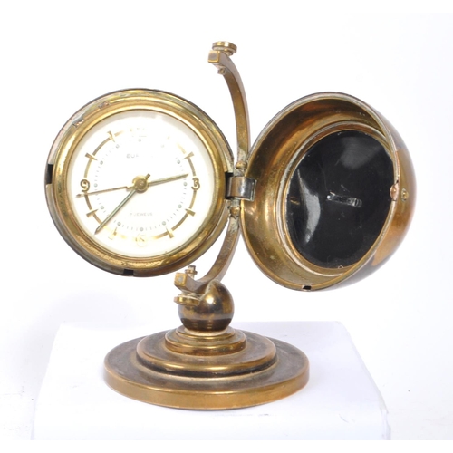 280 - Europa - Seven Jewels - A vintage 20th century desk top clock in the form of a globe. With stepped c... 