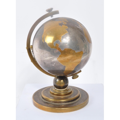 280 - Europa - Seven Jewels - A vintage 20th century desk top clock in the form of a globe. With stepped c... 