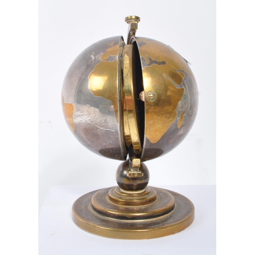 280 - Europa - Seven Jewels - A vintage 20th century desk top clock in the form of a globe. With stepped c... 