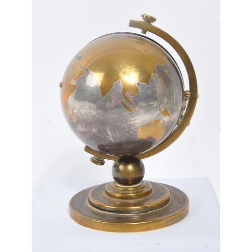 280 - Europa - Seven Jewels - A vintage 20th century desk top clock in the form of a globe. With stepped c... 