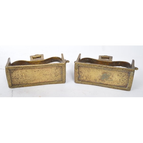 281 - A pair of 19th century brass Indian horse stirrups. Having a curved support arm with holes for ties.... 