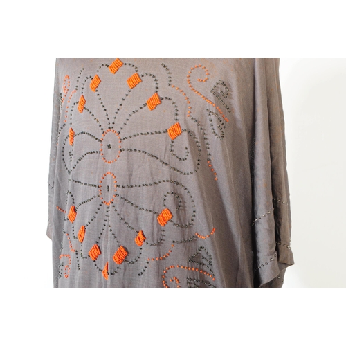 282 - A 1920s era Canadian beaded rayon dress in grey with vibrant orange beads decorating repeated patter... 