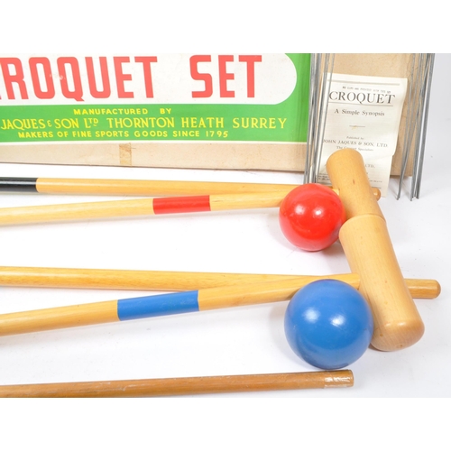 286 - A 20th Century vintage Jaques Croquet Set to include four mallets, four coloured balls, two stakes a... 