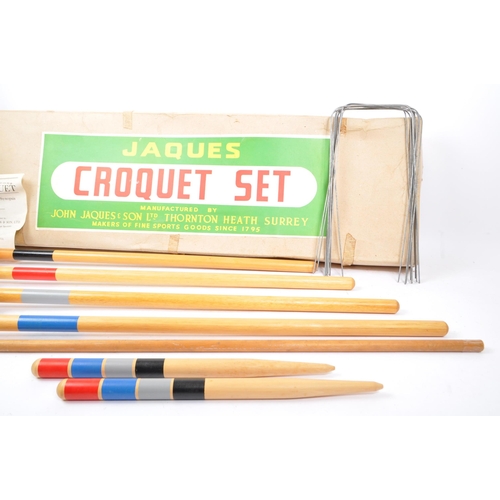 286 - A 20th Century vintage Jaques Croquet Set to include four mallets, four coloured balls, two stakes a... 