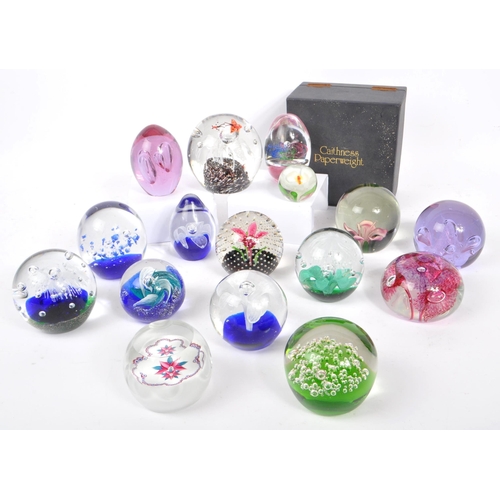 32 - A large collection of assorted mid century / vintage studio art glass paperweights. Comprising of mu... 