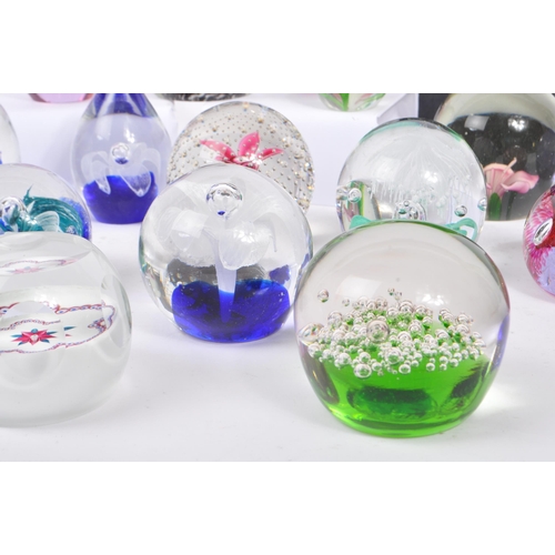 32 - A large collection of assorted mid century / vintage studio art glass paperweights. Comprising of mu... 