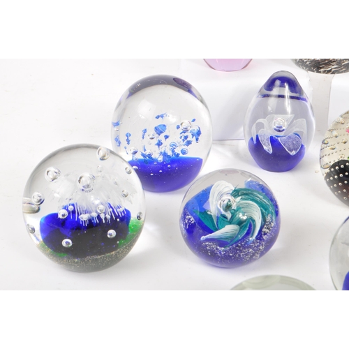 32 - A large collection of assorted mid century / vintage studio art glass paperweights. Comprising of mu... 