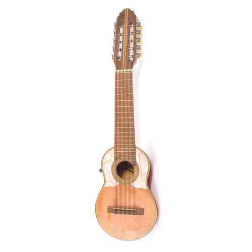 407 - A South American ten-string electric 10 string charango guitar. With shell insert and inlaid wood  d... 