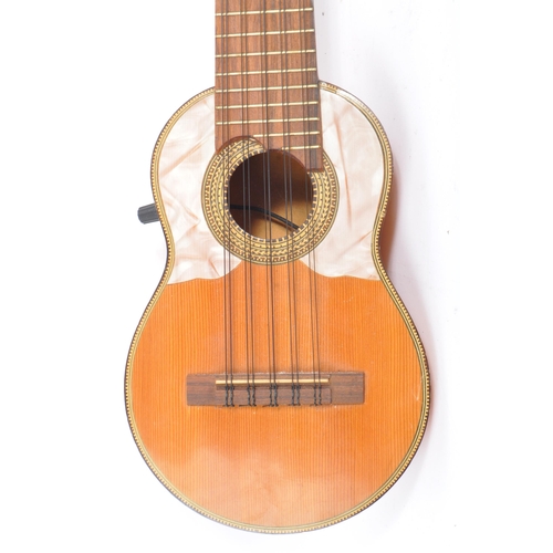 407 - A South American ten-string electric 10 string charango guitar. With shell insert and inlaid wood  d... 