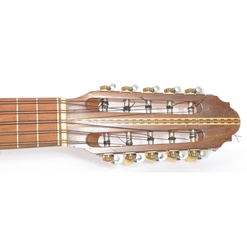 407 - A South American ten-string electric 10 string charango guitar. With shell insert and inlaid wood  d... 