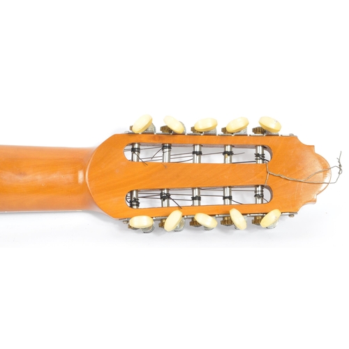 407 - A South American ten-string electric 10 string charango guitar. With shell insert and inlaid wood  d... 