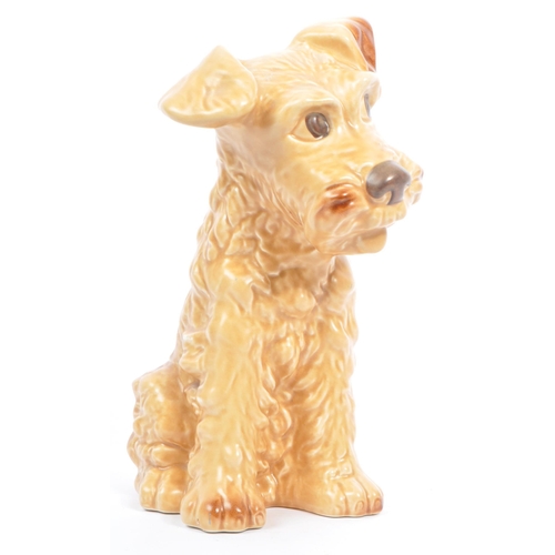 41 - Sylvac - A large mid century ceramic Sylvac figure in the form of a brown terrier dog. The dog in si... 