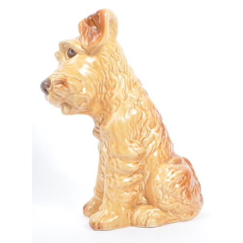 41 - Sylvac - A large mid century ceramic Sylvac figure in the form of a brown terrier dog. The dog in si... 