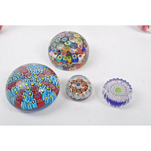 43 - A collection of vintage 20th century glass paperweights to include Murano millefiori, bubble control... 