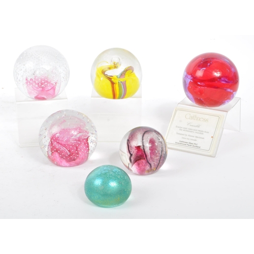 43 - A collection of vintage 20th century glass paperweights to include Murano millefiori, bubble control... 