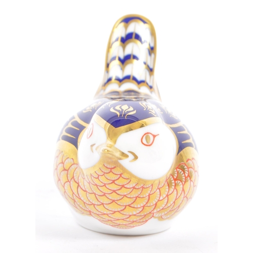 45 - Royal Crown Derby - A contemporary porcelain china paperweights in the form of a Wren with gilt stop... 