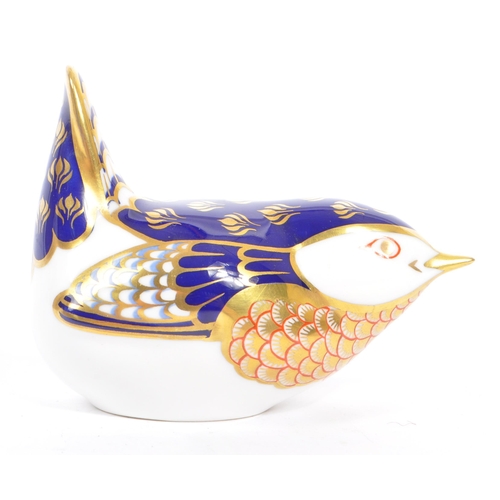 45 - Royal Crown Derby - A contemporary porcelain china paperweights in the form of a Wren with gilt stop... 