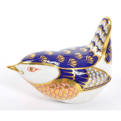 45 - Royal Crown Derby - A contemporary porcelain china paperweights in the form of a Wren with gilt stop... 