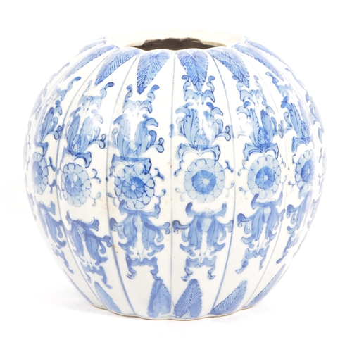 46 - A large blue and white contemporary Chinese pumpkin shaped vase with floral decoration. Measures 21 ... 