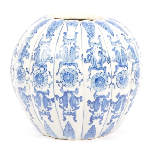 46 - A large blue and white contemporary Chinese pumpkin shaped vase with floral decoration. Measures 21 ... 