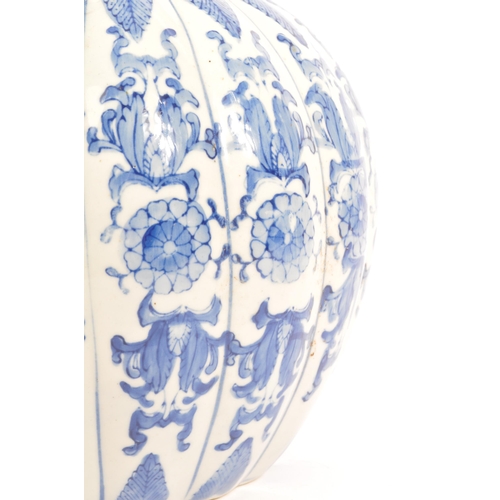 46 - A large blue and white contemporary Chinese pumpkin shaped vase with floral decoration. Measures 21 ... 