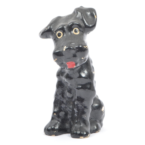 54 - A fine bone ceramic china & ceramic seated terrier dog animal figurine. In a black colourway / red t... 