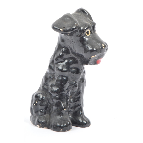 54 - A fine bone ceramic china & ceramic seated terrier dog animal figurine. In a black colourway / red t... 