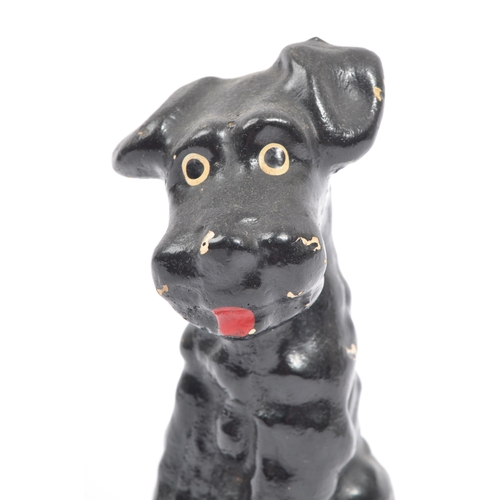 54 - A fine bone ceramic china & ceramic seated terrier dog animal figurine. In a black colourway / red t... 