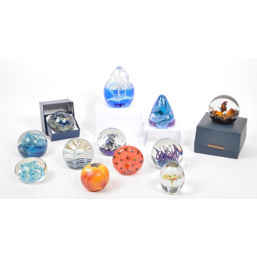 64 - A large collection of assorted mid century / vintage studio art glass paperweights. Comprising of mu... 