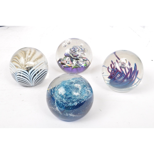 64 - A large collection of assorted mid century / vintage studio art glass paperweights. Comprising of mu... 