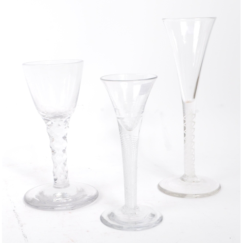 66 - A collection of three 18th century Georgian stemmed wine glasses. The glasses each of stemmed design... 