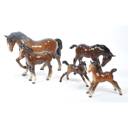 73 - Beswick - A collection of Beswick porcelain horse figurines to include five brown examples. Stamped ... 