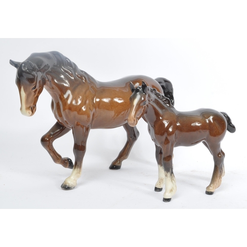 73 - Beswick - A collection of Beswick porcelain horse figurines to include five brown examples. Stamped ... 