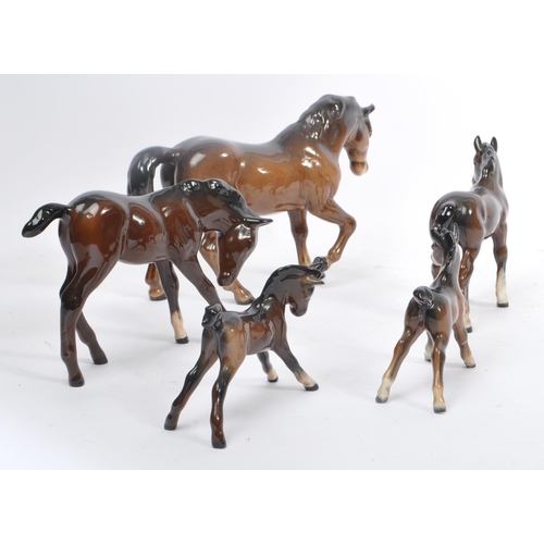 73 - Beswick - A collection of Beswick porcelain horse figurines to include five brown examples. Stamped ... 