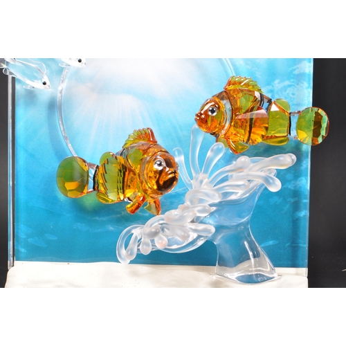 86 - Swarovski - A collection of boxed Swarovski crystal decorative marine life pieces. The collection to... 