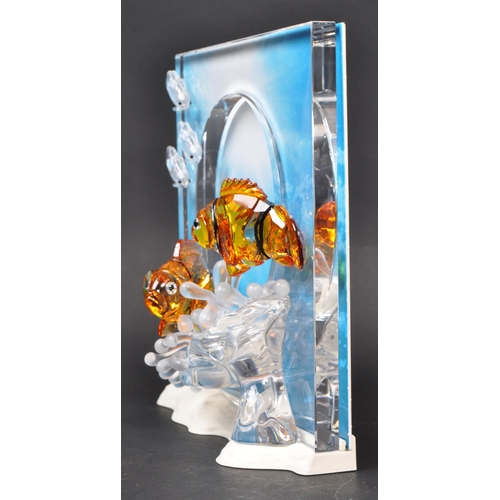 86 - Swarovski - A collection of boxed Swarovski crystal decorative marine life pieces. The collection to... 