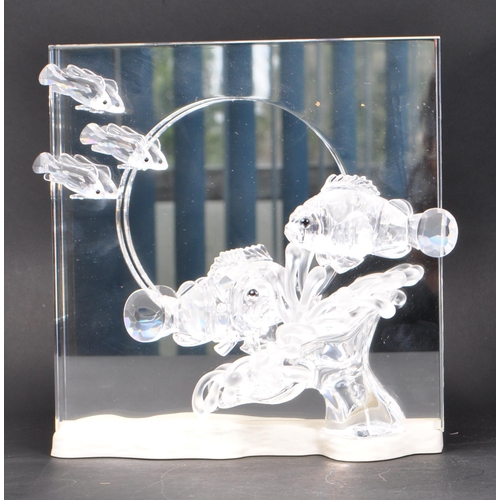 86 - Swarovski - A collection of boxed Swarovski crystal decorative marine life pieces. The collection to... 