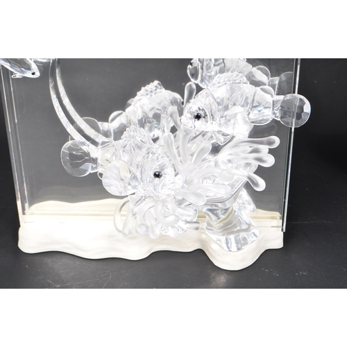 86 - Swarovski - A collection of boxed Swarovski crystal decorative marine life pieces. The collection to... 