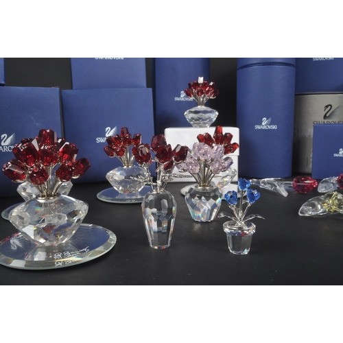 89 - Swarovski - A collection of Swarovski crystal decorative floral figures / ornaments. The collection ... 