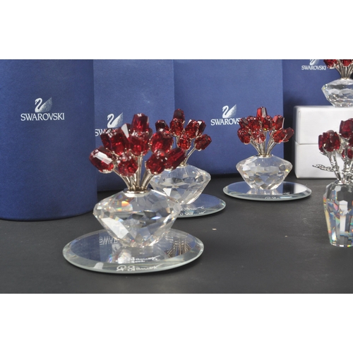 89 - Swarovski - A collection of Swarovski crystal decorative floral figures / ornaments. The collection ... 