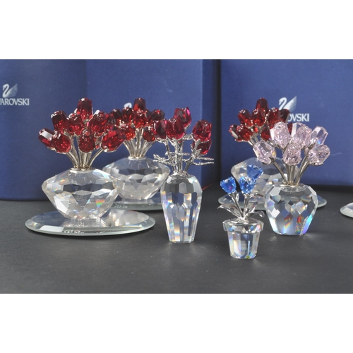 89 - Swarovski - A collection of Swarovski crystal decorative floral figures / ornaments. The collection ... 